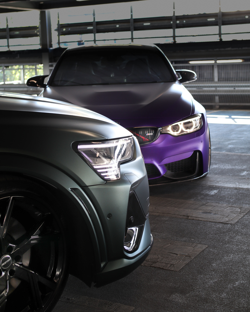 Close-Up Shot of Matte Black and Purple Cars